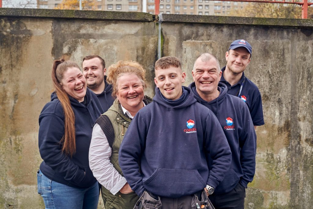 Team of Copley Pest Solutions short term loans UK staff wearing branded jumpers